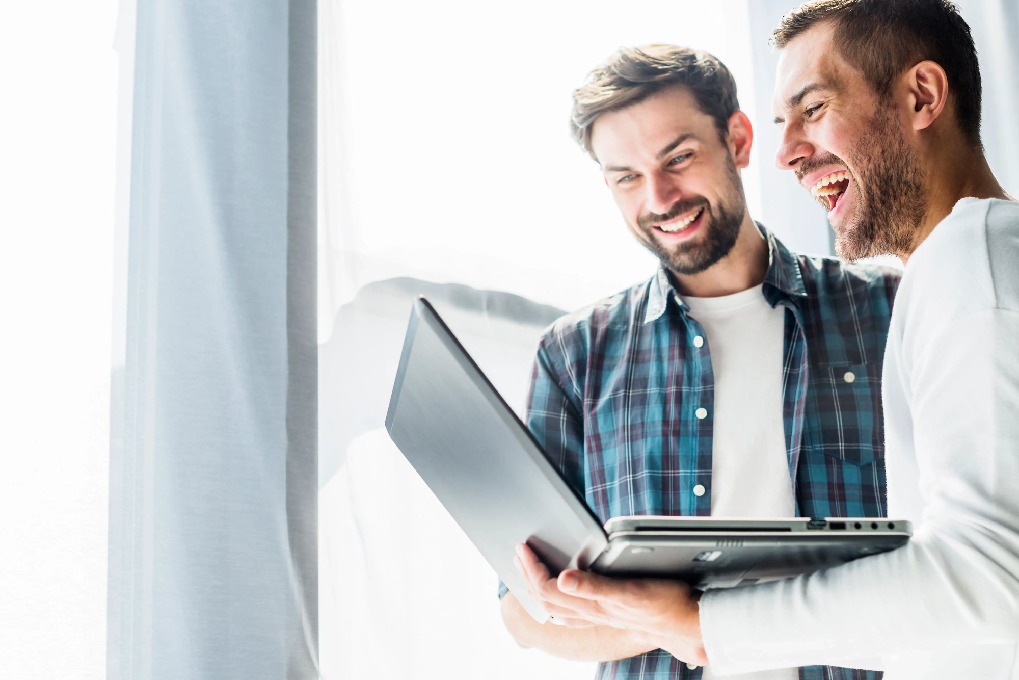 two-happy-businessman-working-laptop (3) (1)